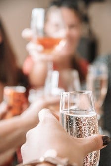 Toasting at a party with Prosecco! (Credit: Kate Dacres-Mannings, Unsplash.com)