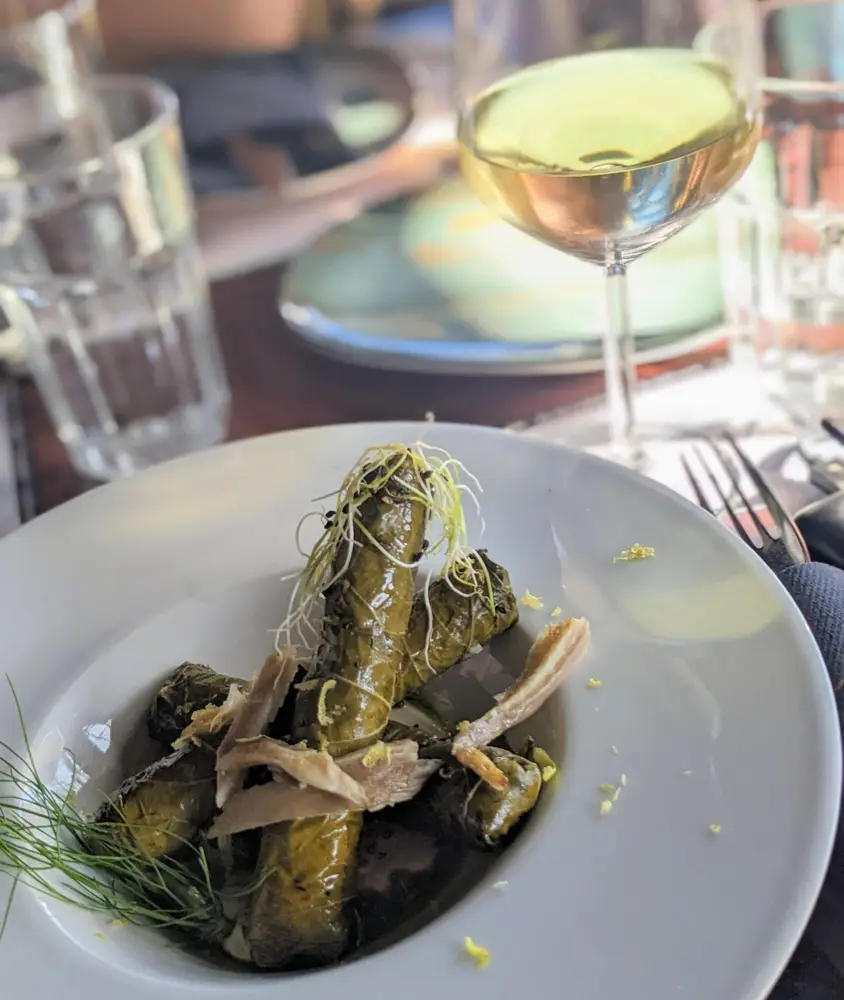 Visiting a vineyard in Greece and tasting the local dish Dolmades, grape leaves stuffed with rice (Photo: Sylvia Ba)