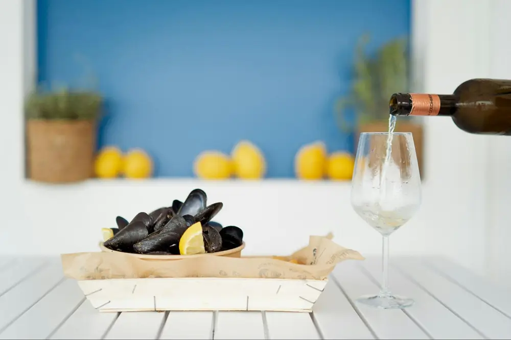 Viognier’s vibrant character compliments everything from shrimp skewers to spicy chicken effortlessly (Photo: Mitili Mitili from Unsplash)