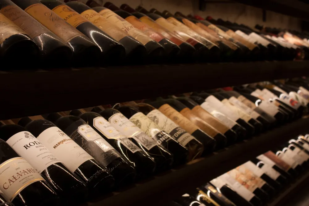 A collection of wines in a wine cellar (Javier Balseiro, unsplash.com)