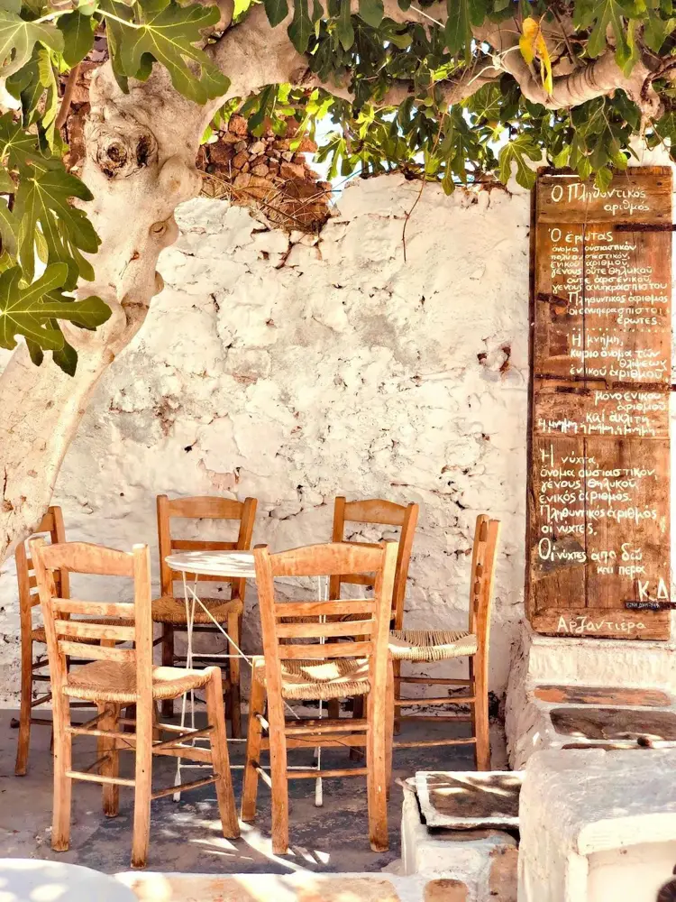 The best thing to do when in Greece is to sit in a tavern and enjoy local food and wine (Credit: Despina Galani, unsplash.com)