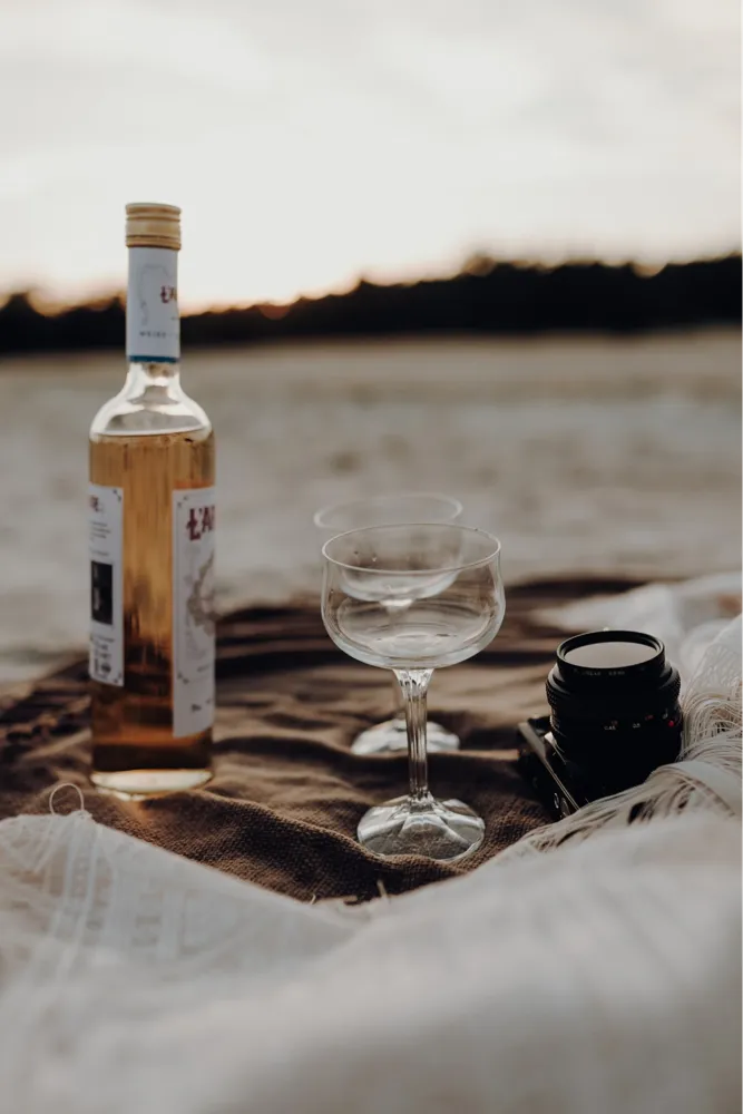 Enjoy your best life with a glass of rosé (Photo: Photo by<a href="https://unsplash.com/@mimipic_photography?utm_content=creditCopyText&amp;utm_medium=referral&amp;utm_source=unsplash"> </a><a href="https://unsplash.com/@mimipic_photography?utm_content=creditCopyText&amp;utm_medium=referral&amp;utm_source=unsplash">Mimipic Photography</a> on<a href="https://unsplash.com/photos/clear-wine-glass-beside-black-ceramic-mug-on-brown-wooden-table-XLJc3dce78U?utm_content=creditCopyText&amp;utm_medium=referral&amp;utm_source=unsplash"> </a><a href="https://unsplash.com/photos/clear-wine-glass-beside-black-ceramic-mug-on-brown-wooden-table-XLJc3dce78U?utm_content=creditCopyText&amp;utm_medium=referral&amp;utm_source=unsplash">Unsplash</a>)