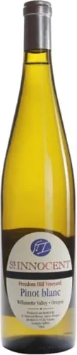 Bottle of St. Innocent Freedom Hill Vineyard Pinot Blancwith label visible
